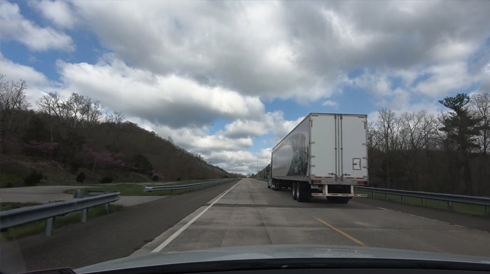 Driver view of a car passing a truck